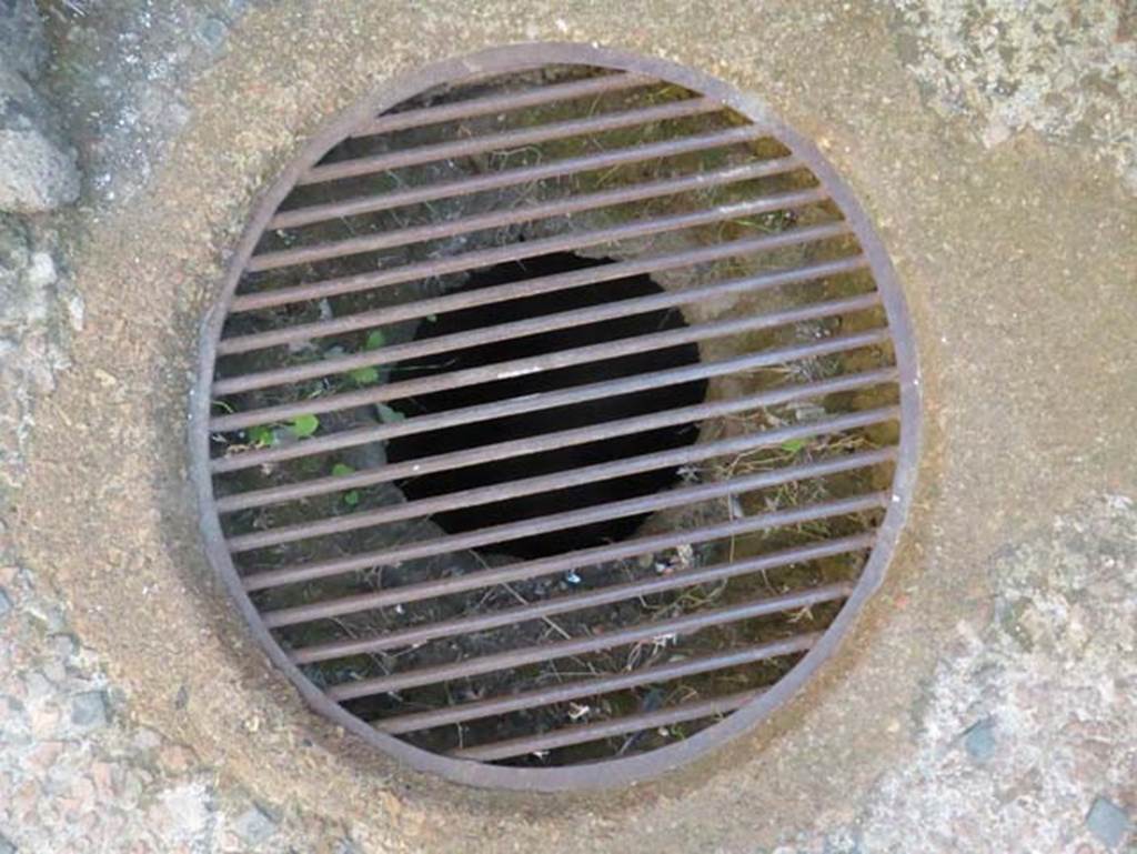 V.10, Herculaneum, September 2015. Cistern mouth or well in floor of shop-room.